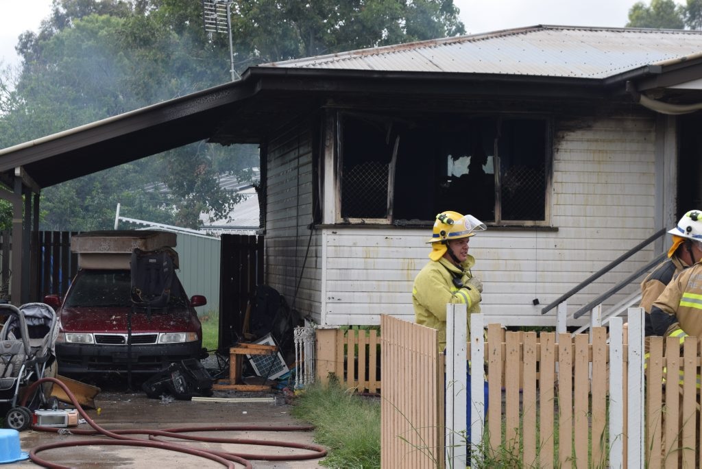 Queensland Fire and Emergency Services personnel at a house fire in Dalby.