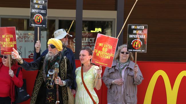 Belgrave wizard Baba Desi protesting outside Tecoma Macca’s. Picture: Stuart Milligan