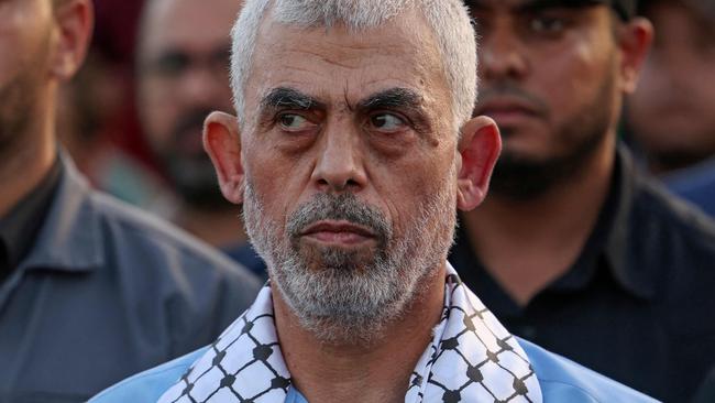 Head of the political wing of the Palestinian Hamas movement in the Gaza Strip Yahya Sinwar attends a rally in support of Jerusalem's al-Aqsa mosque in Gaza City on October 1, 2022. (Photo by MAHMUD HAMS / AFP).