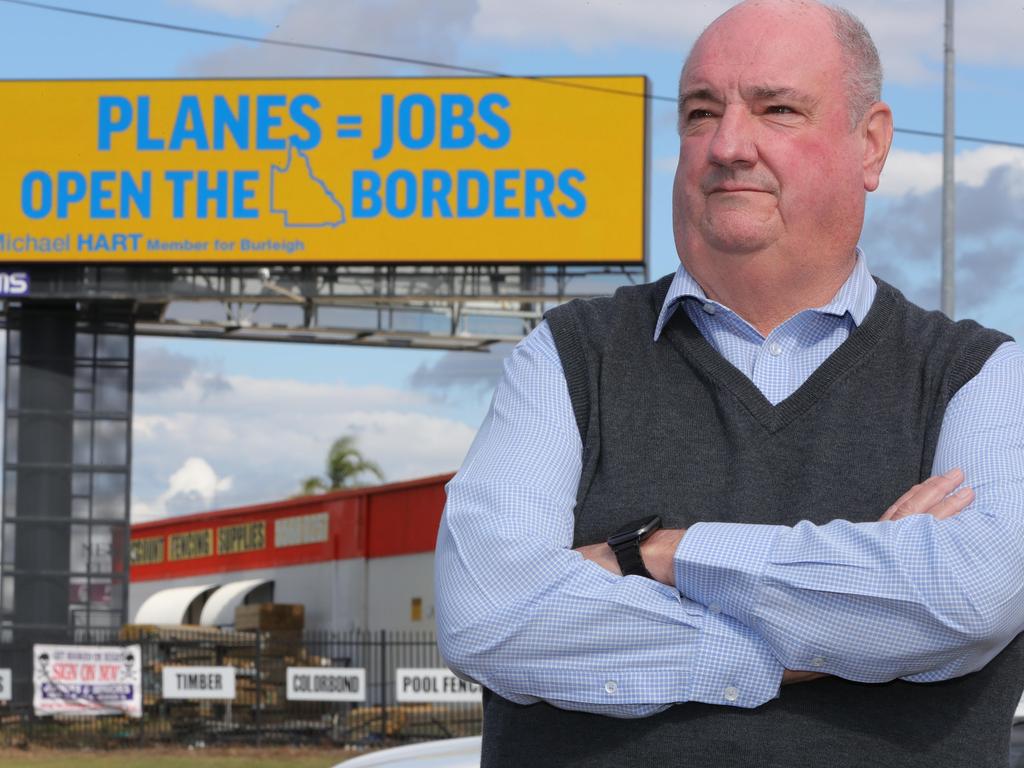 Michael Hart MP (closest camera) unveils a new billboard campaign calling on Labor to end the border shambles and get more flights into the Gold Coast. Picture: Glenn Hampson