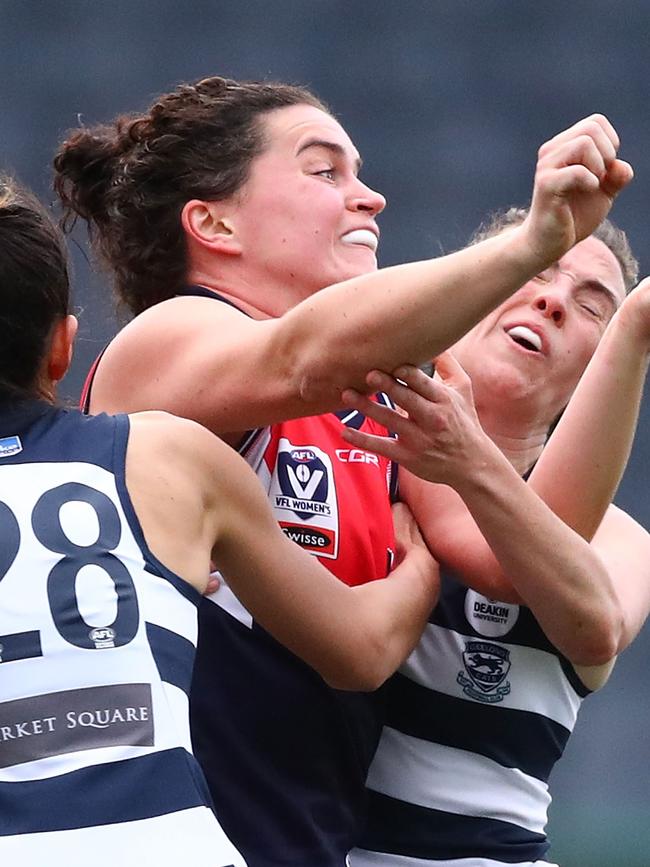 Meg McDonald is sandwiched in a pack while playing for Darebin Falcons in VFLW. 