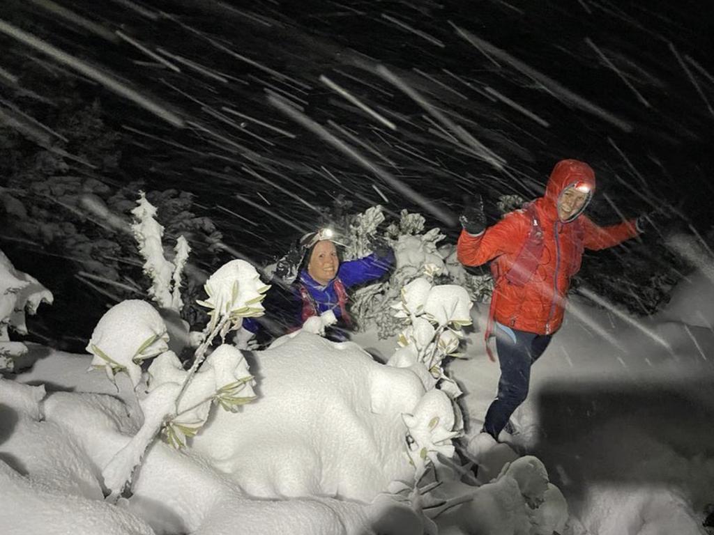 Jessica Robbins and Kirsten Fairfax walking up kunanyi/Mount Wellington in the dark in the snow. Picture: Jessica Robbins