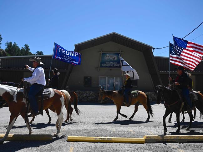 Supporters of US President Donald Trump ride through Keystone. Picture: AFP