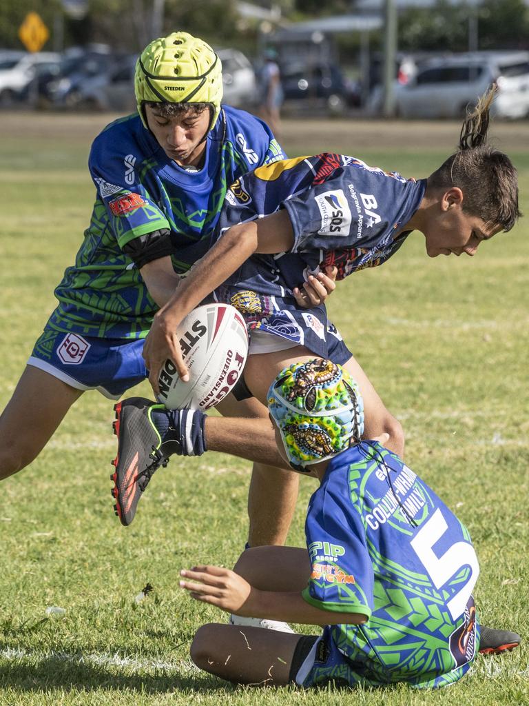 Temanu Taahi and Noah Auld for Pacific tackle Ashley Cubby for Emus. Under 15's boys SW Qld Emus vs Pacific Nations Toowoomba. Saturday, February 25, 2023. Picture: Nev Madsen.