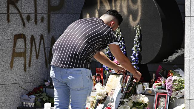 Family and friends pay tribute to Amar Kettule where he was shot. Picture: Adam Yip