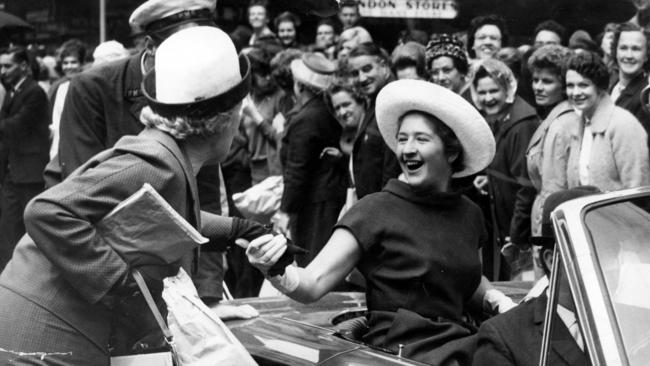 Dawn greets the crowds on Bourke St, Melbourne, in 1964.