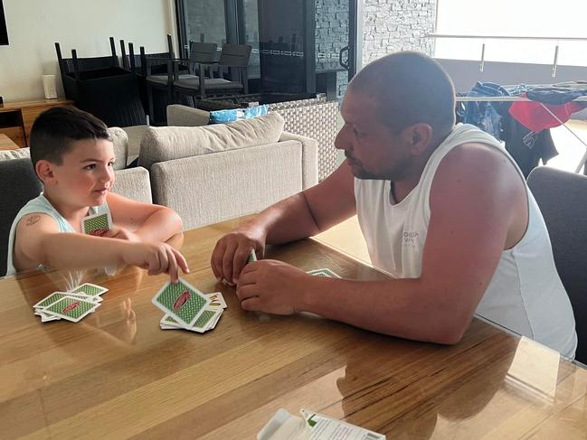 Damian,  Katie,  Andre, Danny,  Luca, Milan and Paul Mandarano got stuck indoors during their holidays on Hamilton Island as tropical cyclone Kirrily is forecasted to land in Townsville on Thursday night. Picture: Katie Mandarano