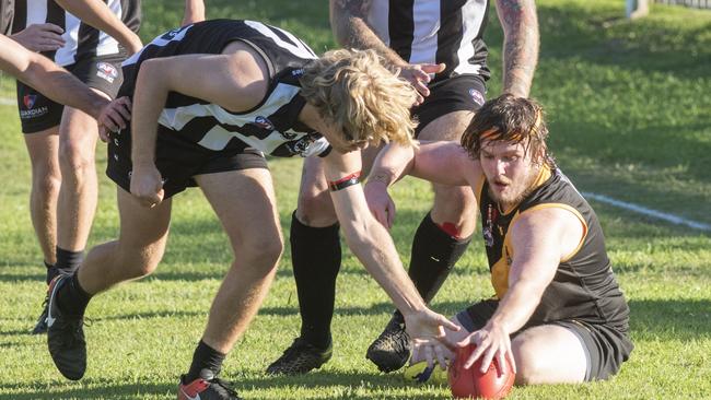 Grafton Tigers Geoff O'Connor fights for the ball close to the boundary line.