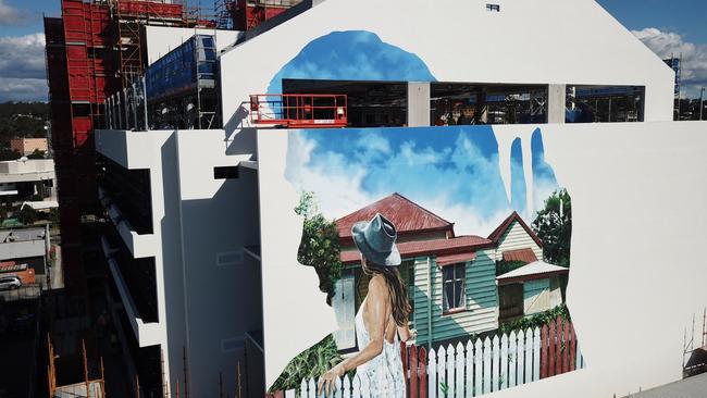 Brisbane artist Gus Eagleton painted this 16m x 15m work showing a typical Beenleigh house on the northern side of the Beenleigh York St tower.