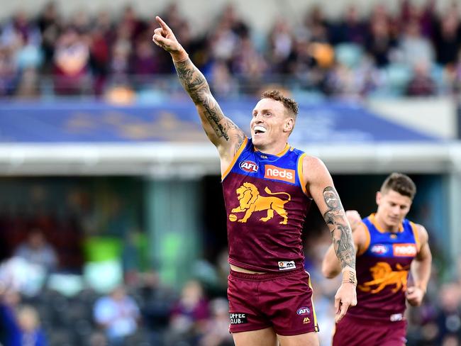 BRISBANE, AUSTRALIA - AUGUST 04: Mitch Robinson of the Lions celebrates kicking a goal during the round 20 AFL match between the Brisbane Lions and the Western Bulldogs at The Gabba on August 04, 2019 in Brisbane, Australia. (Photo by Bradley Kanaris/AFL Photos via Getty Images )