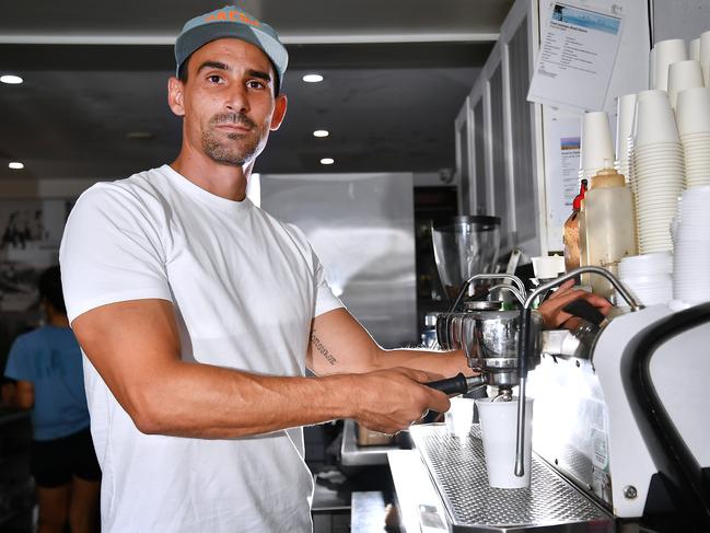 Tobias Diamandopoulos with a Coffee on the beach in Mermaid Beach.The price of your morning coffee is tipped to break the $10 mark by the end of 2025Thursday January 2, 2025. Picture, John Gass