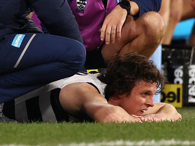 Max Holmes receives treatment during the game. Picture by Michael Klein