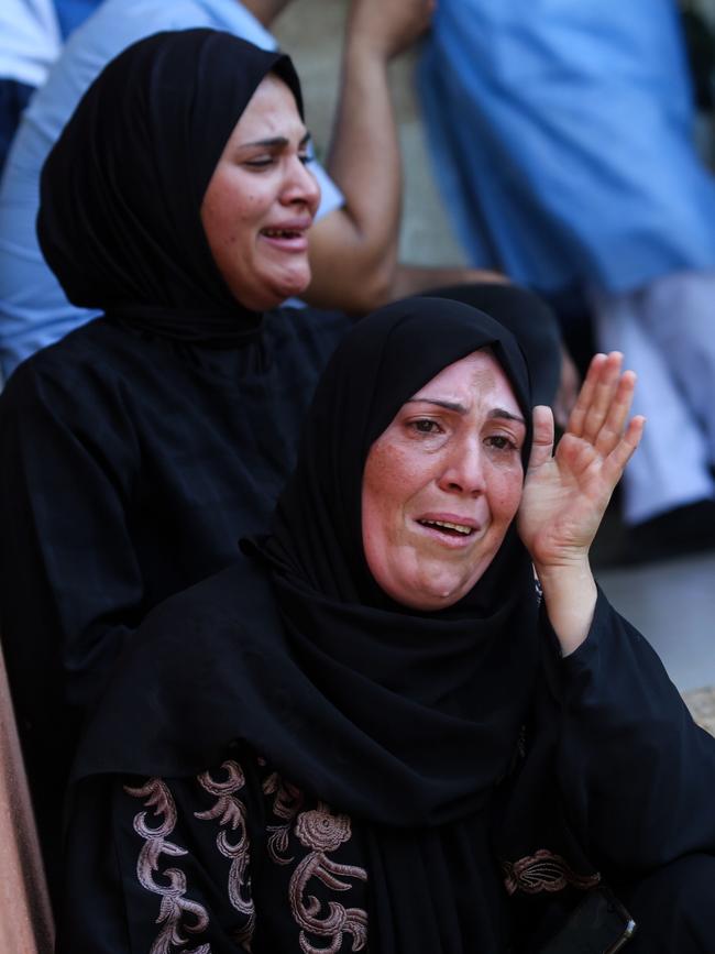 A woman cries as she bids farewell to the bodies of Palestinians killed during Israeli air strikes on October 19, 2023 in Khan Yunis, Gaza. Picture: Ahmad Hasaballah/Getty Images