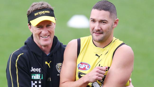 MELBOURNE, AUSTRALIA - MAY 10: Tigers head coach Damien Hardwick hugs Shaun Grigg of the Tigers during a Richmond Tigers AFL training session at Punt Road Oval on May 10, 2019 in Melbourne, Australia. (Photo by Michael Dodge/Getty Images)