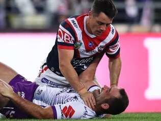 Cooper Cronk and Cameron Smith cross paths in the grand final. Picture: Brett Costello