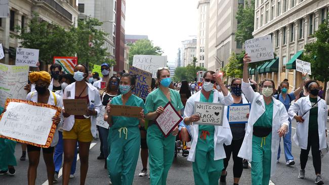 Healthcare workers march during a protest against police brutality and racism on June 6 in Washington DC.