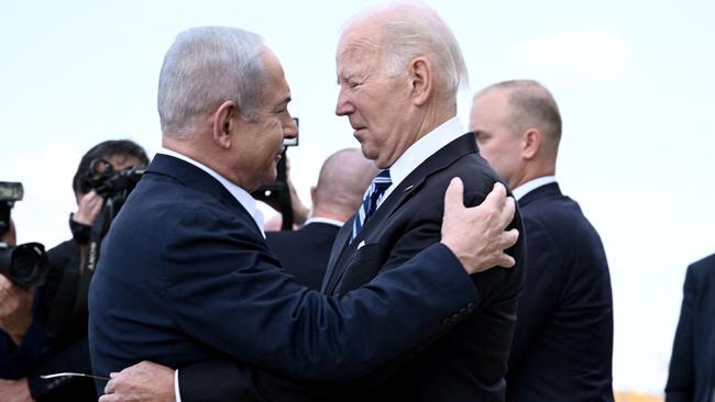 Israel Prime Minister Benjamin Netanyahu (L) greets US President Joe Biden upon his arrival at Tel Aviv's Ben Gurion airport. Picture: AFP.