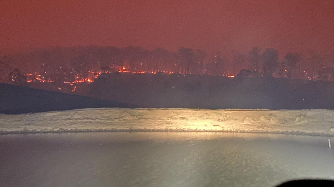 Their car was pointing into the dam, facing the wind, as they watched everything burn. Picture: Supplied