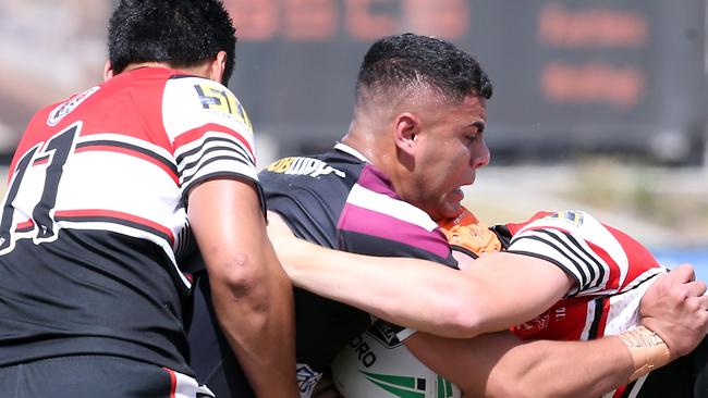 Tony Francis of Marsden SHS is tackled in the NRL Schoolboys QLD final last year against Kirwan SHS. AAP Image/Richard Gosling