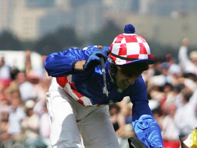 MELBOURNE, AUSTRALIA - NOVEMBER 1:  Jockey Glen Boss crosses the finishing in first place on Makybe Diva during the Melbourne Cup at Flemington Racecourse November 1, 2005 in Melbourne Australia. (Photo by Kristian Dowling/Getty Images)