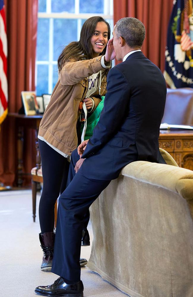“The President’s daughter Malia stopped by the Oval Office one afternoon to see her dad and, while they were talking, she wiped something from his face,” said White House photographer Pete Souza. Picture: Official White House Photo by Pete Souza