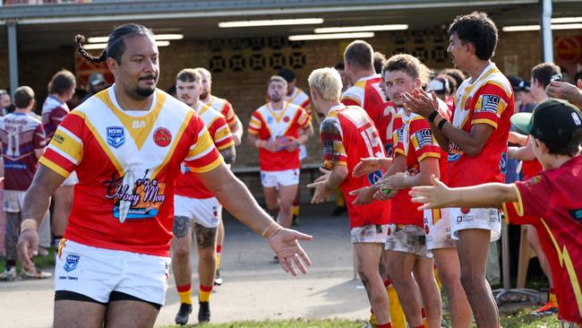 The Comets running onto the field. Picture: D Wigley