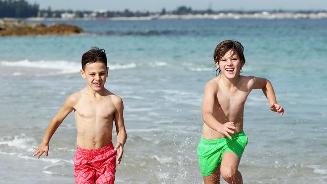 Brothers Dylan and Jadyn Koziwoda playing at Yarra Bay Beach. Picture: Tim Hunter