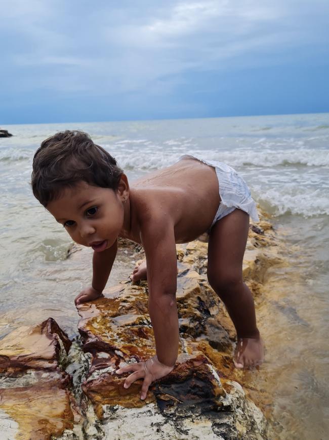 Michael Talbot explored the beach and had spotted a rock to climb ... mission accomplished. Picture: Stacey Talbot