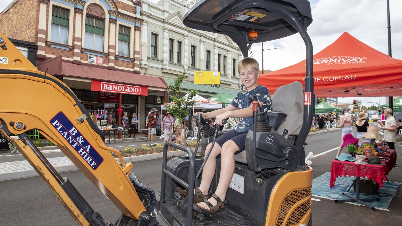 Aidan O'Hara tries out a digger at the Russell Street Refresh block party. Saturday, November 20, 2021. Picture: Nev Madsen.