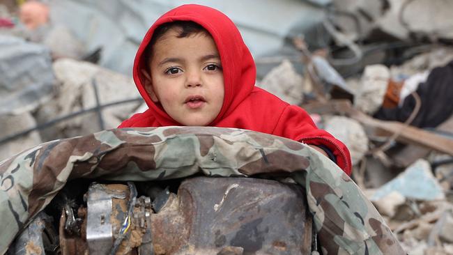 A Palestinian child amid the rubble of destroyed buildings in the northern Gaza Strip. Picture: AFP.