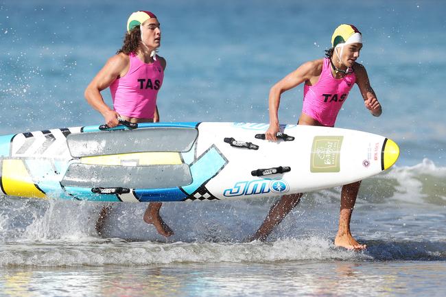 Dusten O’Neil 15 and Jensen Walton 14 of Ulverstone Surf Life Saving Club in the u/15 board rescue. Tasmanian Surf Lifesaving Championships at Clifton Beach. Picture: NIKKI DAVIS-JONES