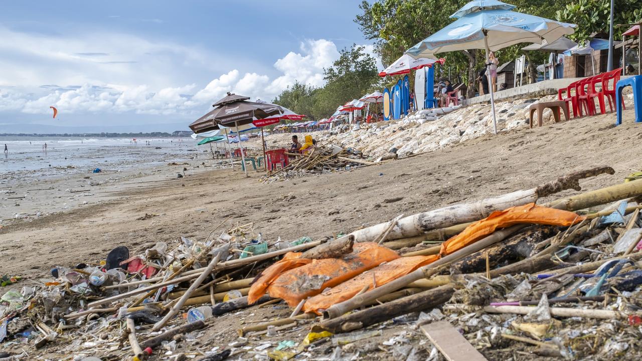 It’s an annual phenomenon that sees plastic garbage, and waste from shipping vessels often carried into land by strong winds, high tides, and driving rains. Picture: Made Nagi/EPA/AAP