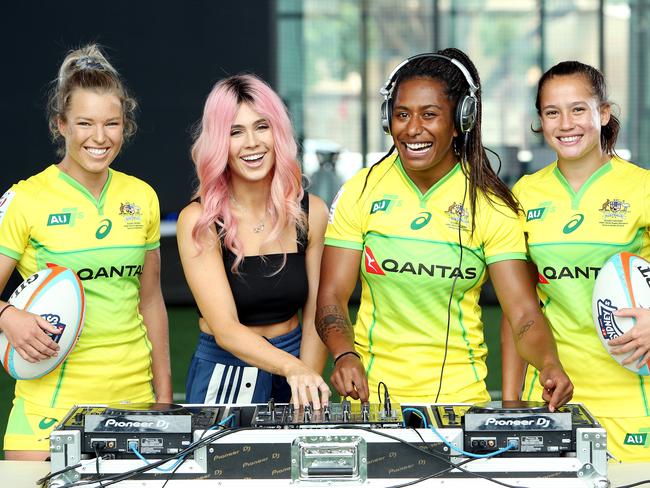 DAILY TELEGRAPH - Pictured at Moore Park today is DJ Tigerlily, with Rugby 7's players Emma Tonegato, Ellia Green and Page McGregor, who will be playing in a Music Festival Zone at the upcoming Rugby 7's tournament. Picture: Tim Hunter.