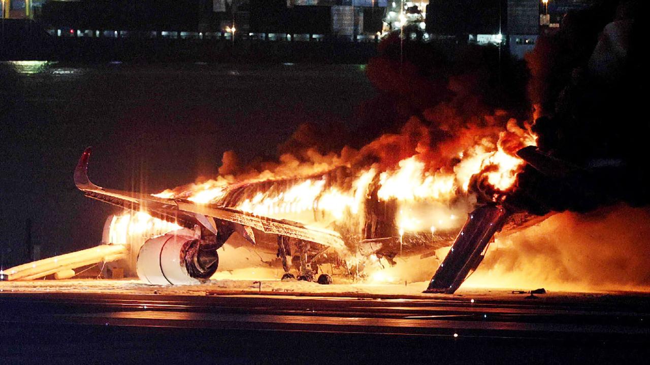 The Japan Airlines plane on fire on a runway of Tokyo's Haneda Airport. Picture: AFP