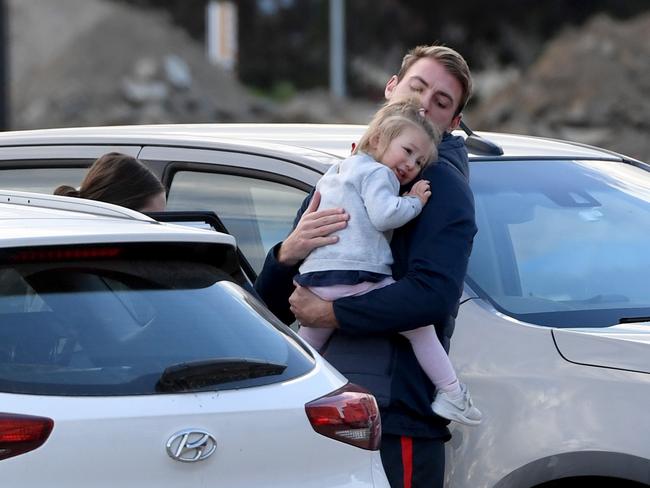 Adelaide Crow Daniel Talia comforts daughter before leaving West Lakes for Covid hub. Picture: Tricia Watkinson