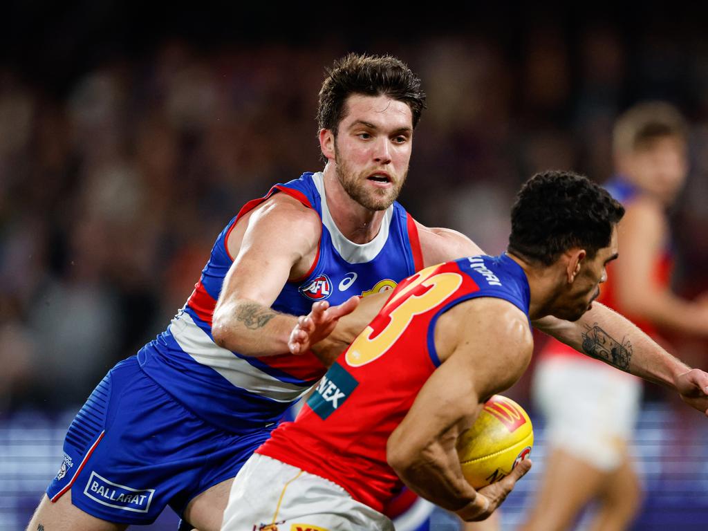 Bailey Williams looks to tackle Charlie Cameron on Friday night. Picture: Dylan Burns/AFL Photos via Getty Images