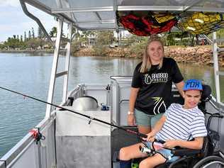 FISH BITING: Bamboo Projects founder Kristy Paterson on the new wheelchair accessible boat with Zane Cecil. Picture: Eden Boyd