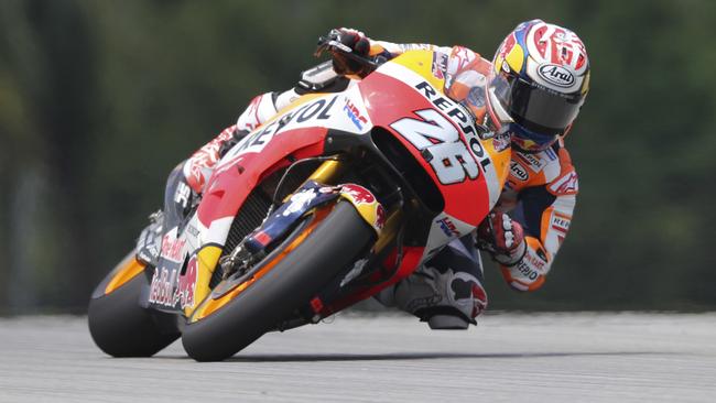 Spain's MotoGP rider Dani Pedrosa steers his Honda during the qualifying session for the Malaysia MotoGP at the Sepang International circuit in Sepang, Malaysia, Saturday, Oct. 28, 2017. (AP Photo/Vincent Phoon)