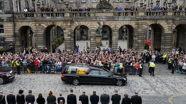 Crowds watch the cortege carrying the coffin of the late Queen Elizabeth II in Edinburgh on Sunday. Queen Elizabeth II died at Balmoral Castle in Scotland on September 8. Picture: Ian Forsyth – WPA Pool/Getty Images