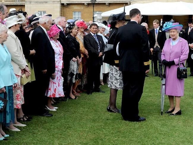 Queen Elizabeth on the lawn of Buckingham Palace before it was ruined. Picture: AP