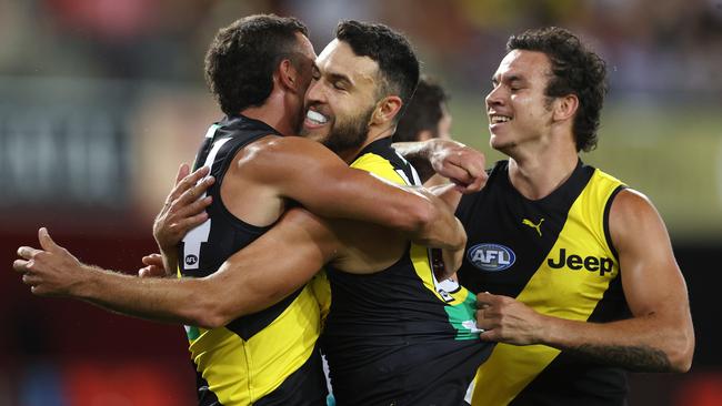 Shane Edwards celebrates his goal in the second quarter as the Tigers leapt out of the boxes.