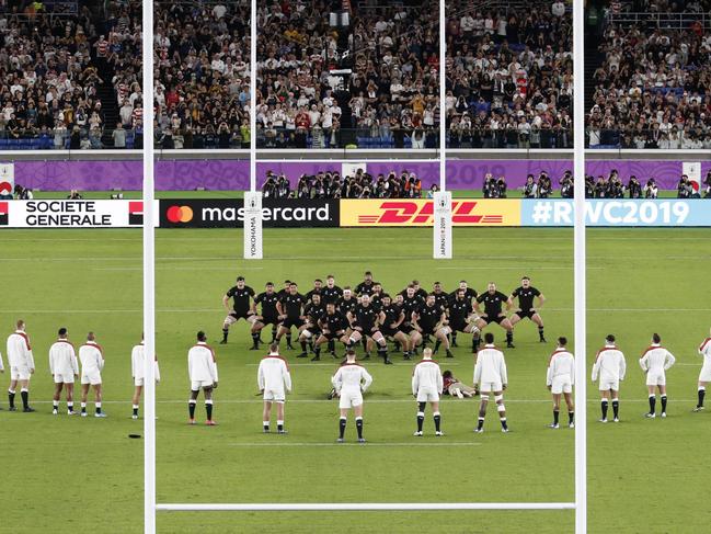 England players watch the All Blacks perform their haka during the Rugby World Cup semifinal at International Yokohama Stadium between New Zealand and England in Yokohama, Japan, Saturday, Oct. 26, 2019. (Kyodo News via AP)