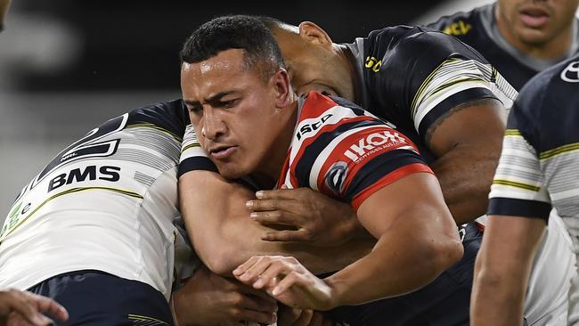 TOWNSVILLE, AUSTRALIA - JULY 09:  Siosiua Taukeiaho of the Roosters is tackled during the round nine NRL match between the North Queensland Cowboys and the Sydney Roosters at QCB Stadium on July 09, 2020 in Townsville, Australia. (Photo by Ian Hitchcock/Getty Images)