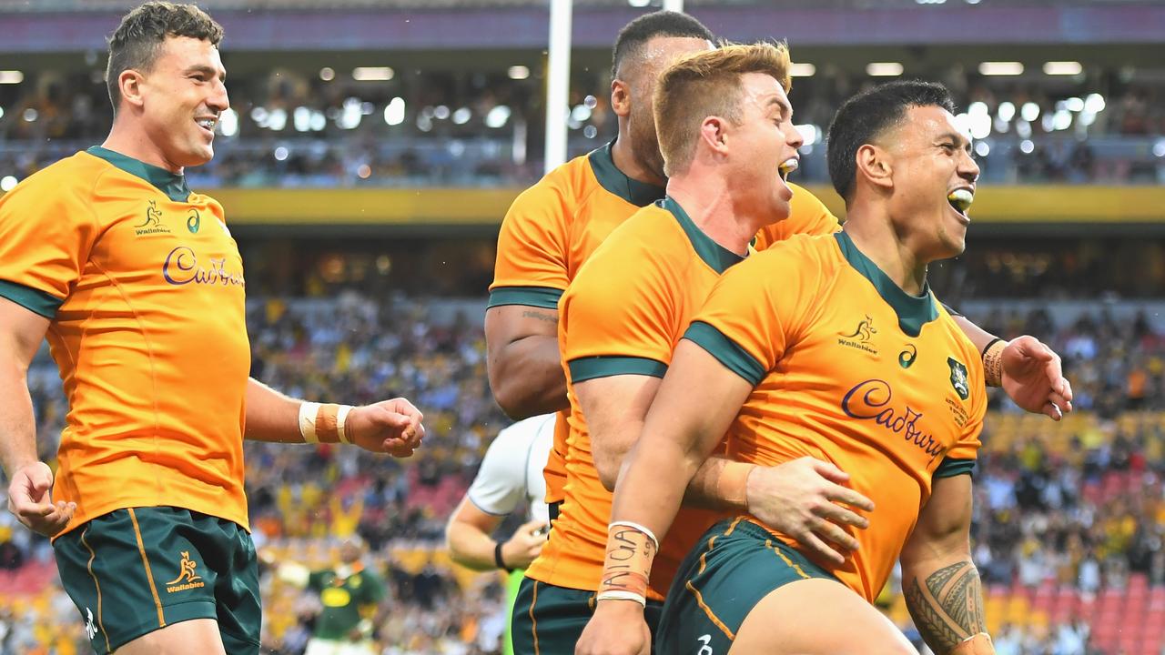 Len Ikitau of the Wallabies celebrates scoring.