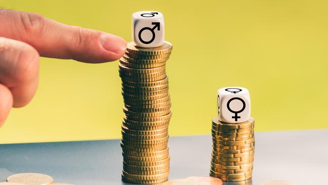 Symbol for unequal payment. Gender symbols on different high stacks of coins. Gender pay gap. Gender inequality. Pay inequality. Picture: iStock