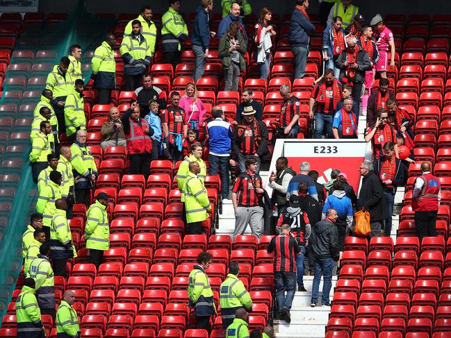 MANCHESTER, ENGLAND - MAY 15: Fans are evacuated from the ground as the match is abandoned ahead of the Barclays Premier League match between Manchester United and AFC Bournemouth at Old Trafford on May 15, 2016 in Manchester, England. (Photo by Alex Livesey/Getty Images) *** BESTPIX ***