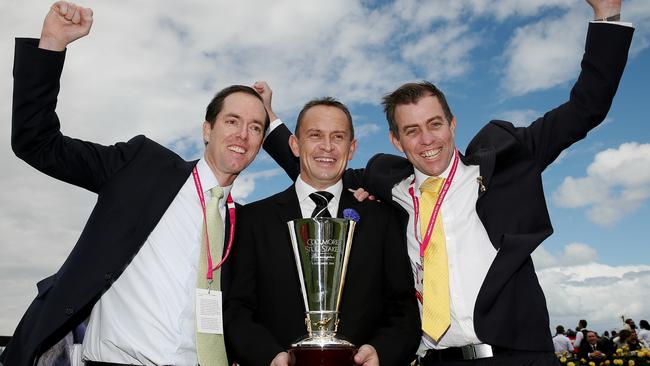 Derby Day Races at Flemington, Race 4, Coolmore Stud Stakes 1200m , Trainer (m) Chris Waller with the trophy and owners (l) Simon Pickworth and (r) Andrew Skelton after the win by Brazen Beau. Melbourne. 1st November 2014. Picture : Colleen Petch