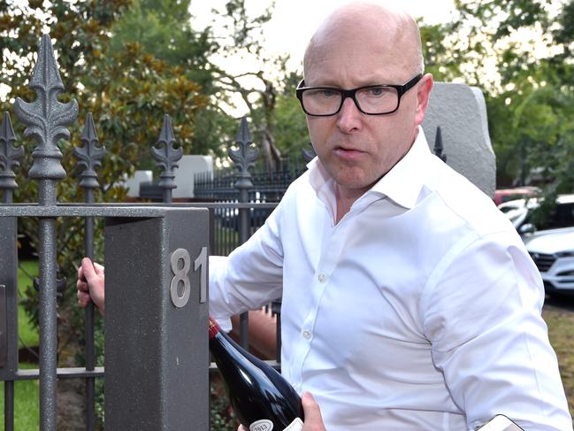 Brian Walsh drops off a bottle of wine at Andrew Thorburn’s house after he announced he was leaving NAB in 2019. Picture Jay Town