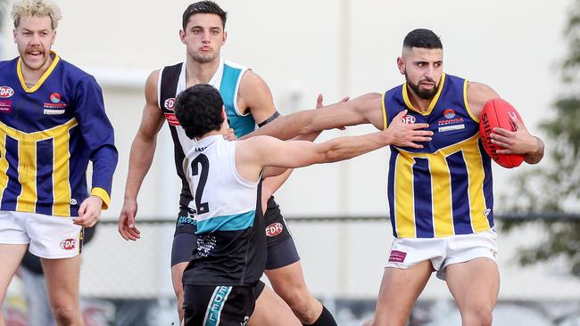 EDFL: Rupertswood’s Matthew Italiano fends off Nicholas Karakyriakos of Hillside. Picture: George Salpigtidis