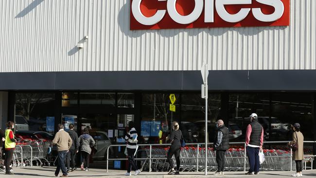 People line up outside a Coles supermarket in Malvern on August 2 in Melbourne. Picture: Darrian Traynor/Getty Images